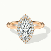 Melanie Marquise Halo Wedding Ring in Rose Gold, featuring a stunning marquise-cut lab-grown diamond and a halo of smaller stones, available in both moissanite and lab-grown diamond options.