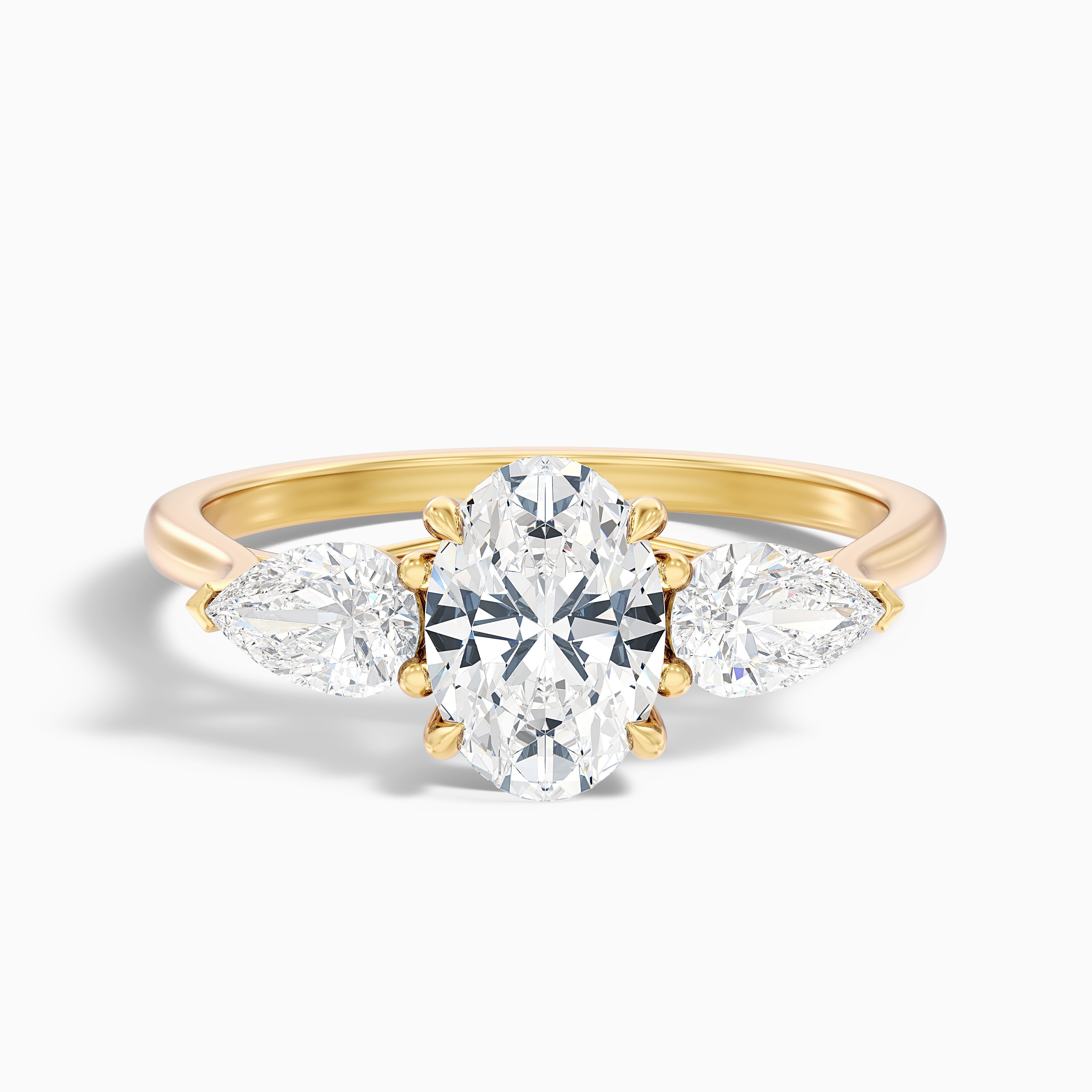 Marcella Oval Three Stone With Pear Moissanite Ring