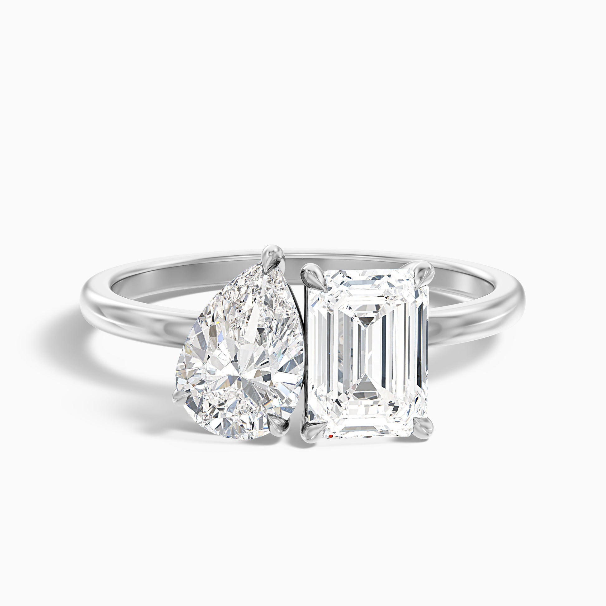 Cecelia Toi Et Moi diamond ring in white gold and platinum featuring pear and emerald cut diamonds, available in both moissanite and lab-grown diamond choices