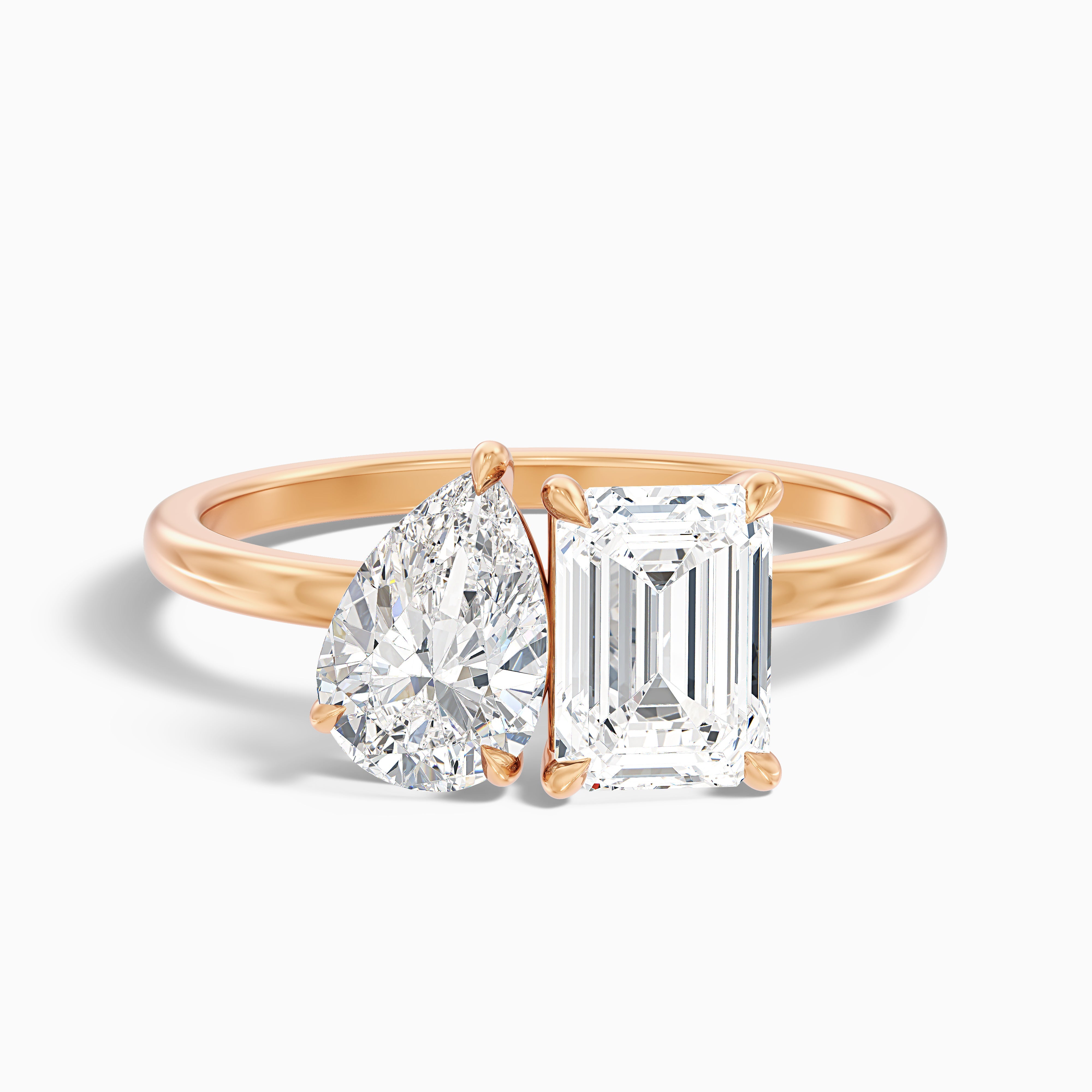 Cecelia Toi Et Moi diamond ring in rose gold featuring pear and emerald cut diamonds, available in both moissanite and lab-grown diamond options. Perfect for engagement