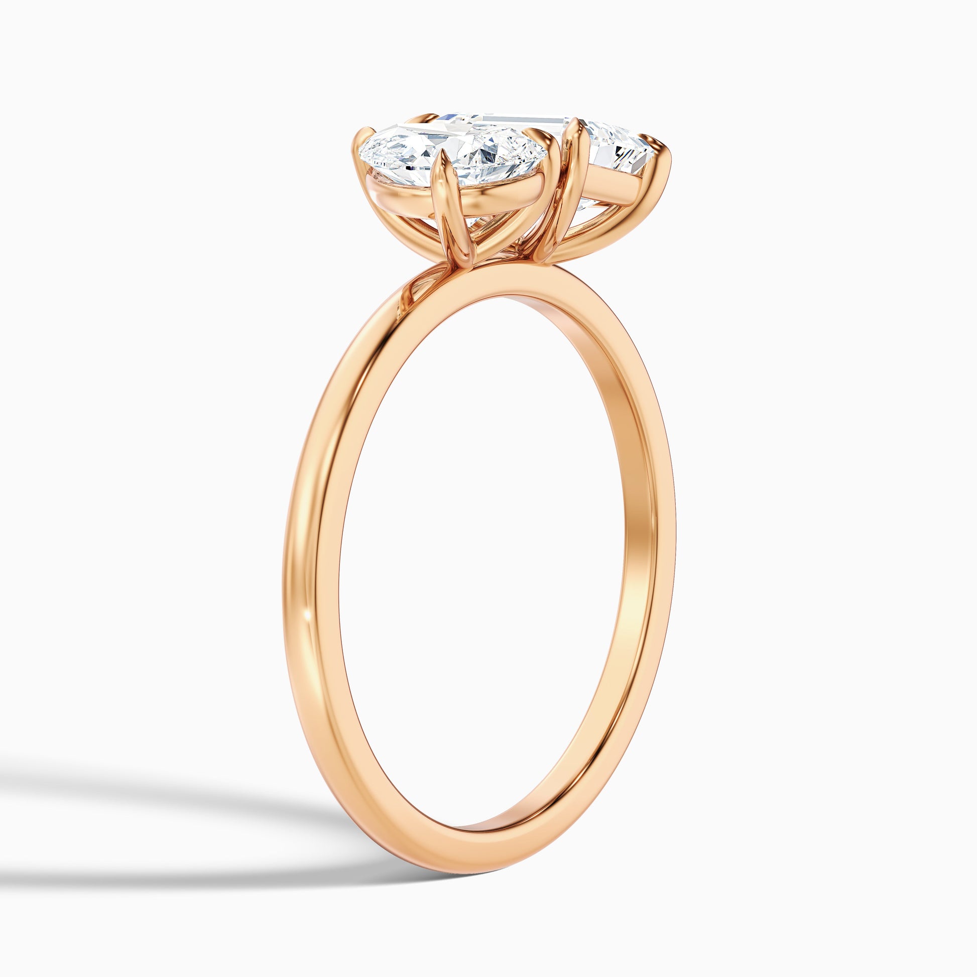 Cecelia Toi Et Moi engagement ring in rose gold, with pear and emerald cut diamonds in moissanite or lab-grown diamond options. Ideal for a timeless engagement ring