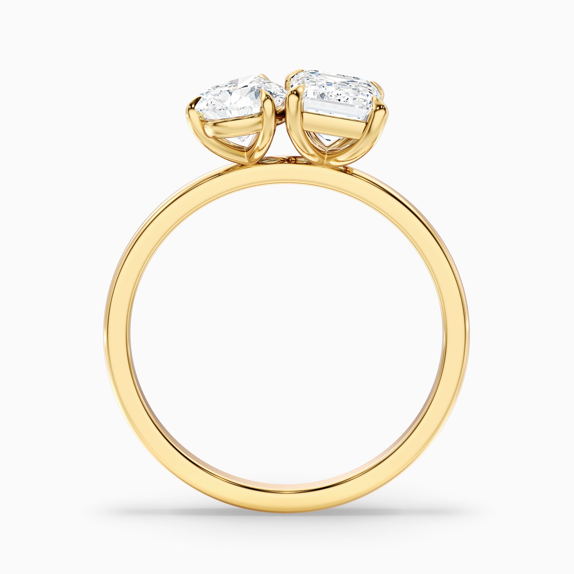 Cecelia Toi Et Moi diamond ring in yellow gold with pear and emerald cut diamonds, perfect for engagement, offered in moissanite and lab-grown diamond varieties