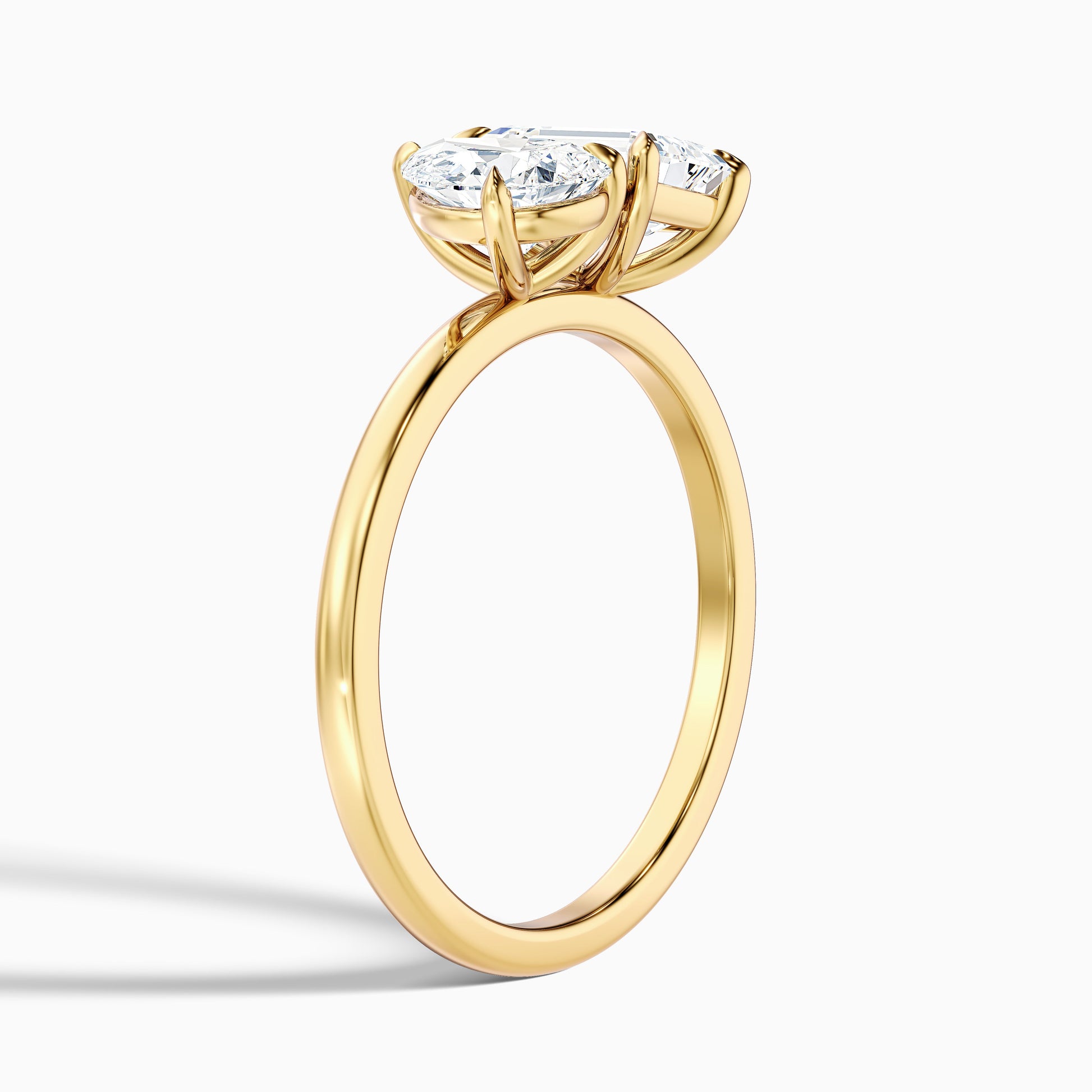 Stunning Cecelia Toi Et Moi engagement ring in yellow gold, featuring pear and emerald cut diamonds, available in moissanite or lab-grown diamond for a customized ring