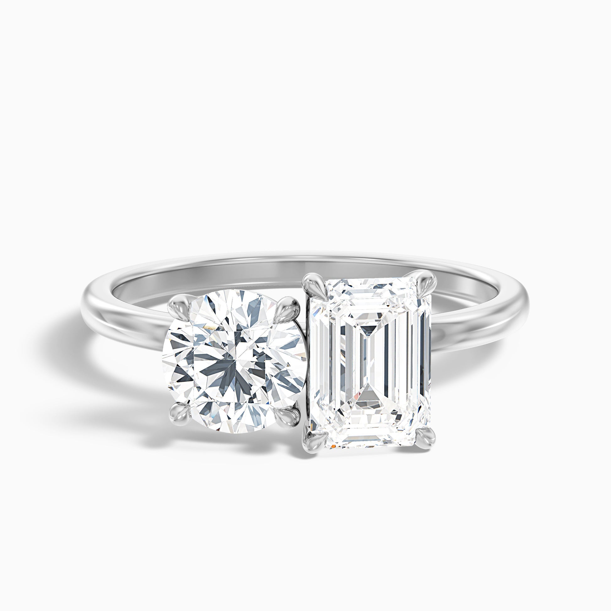 Joanna Toi Et Moi Diamond Ring in White Gold and Platinum, featuring Round and Emerald Cut Diamonds. Available in both Moissanite and Lab-Grown Diamond. A perfect symbol of love