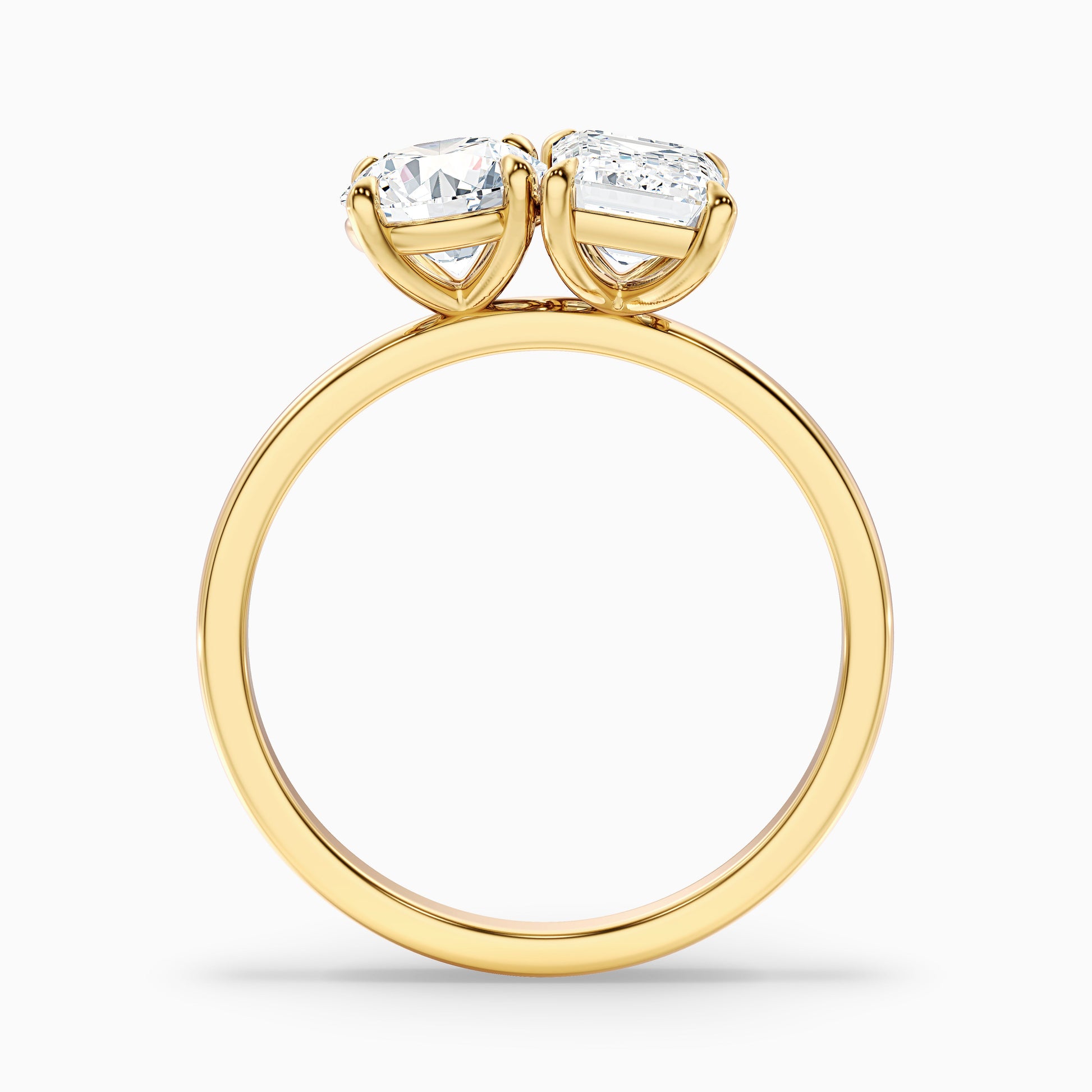 Joanna Toi Et Moi Diamond Ring in Yellow Gold with Round and Emerald Cut Diamonds. Available in both Moissanite and Lab-Grown Diamond. An elegant and timeless choice for an engagement ring