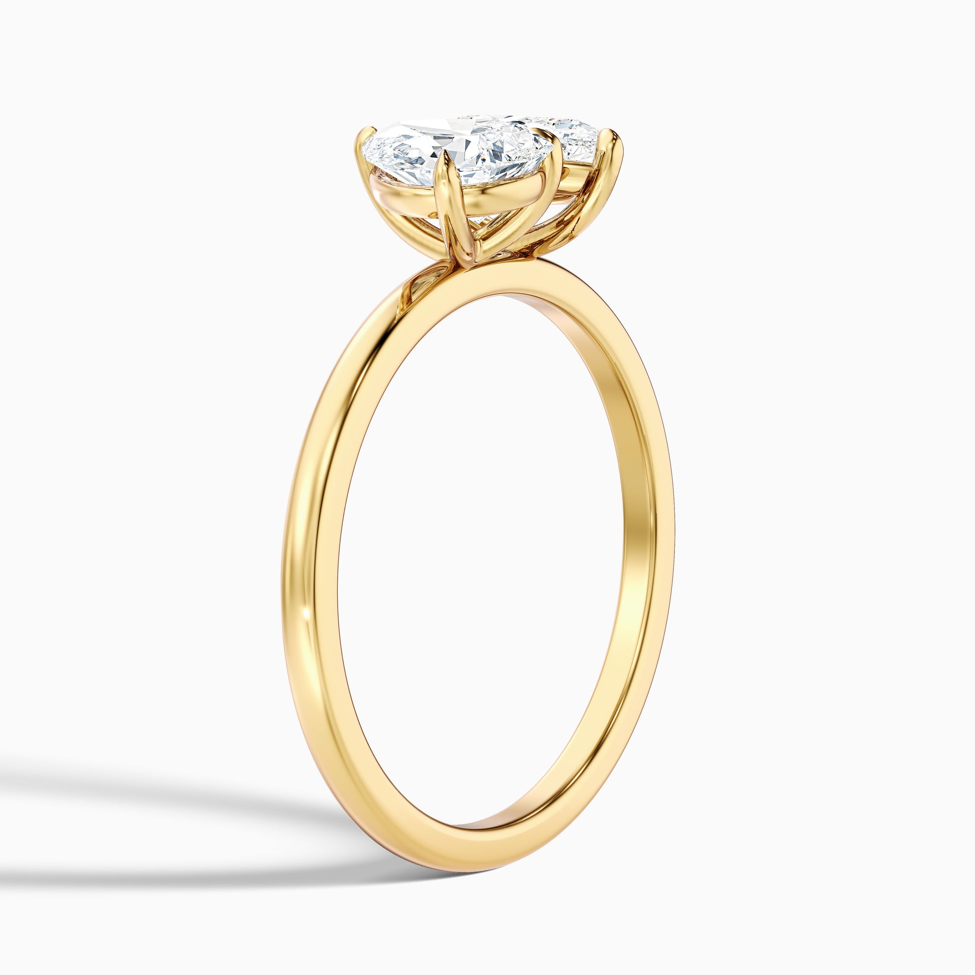 Katrina Toi Et Moi pear diamond engagement ring in yellow gold, available in moissanite and lab-grown diamond for a sustainable and beautiful choice in engagement rings