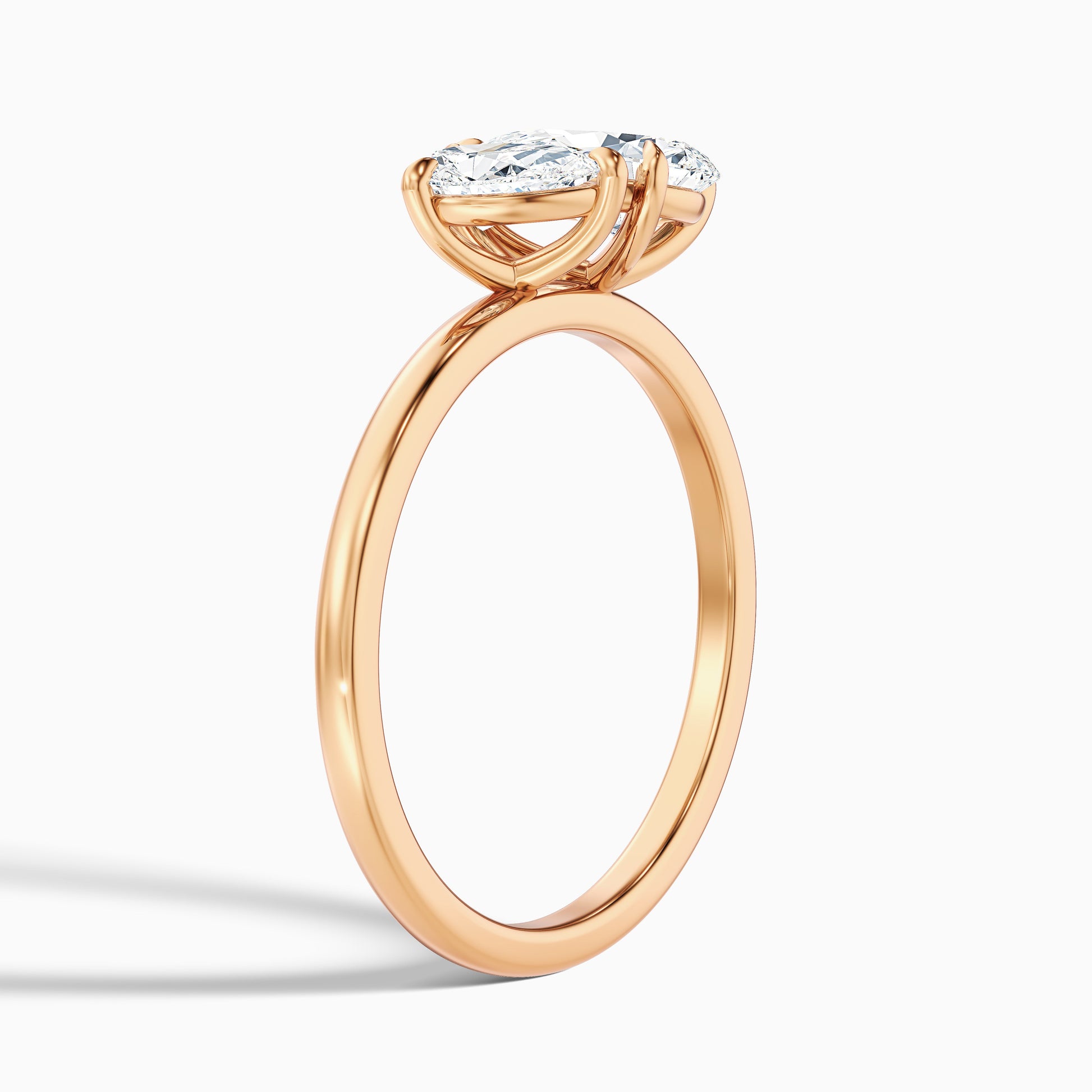 Side profile of Rosalyn Toi Et Moi Engagement Ring featuring pear diamonds in rose gold, available in both moissanite and lab-grown diamond