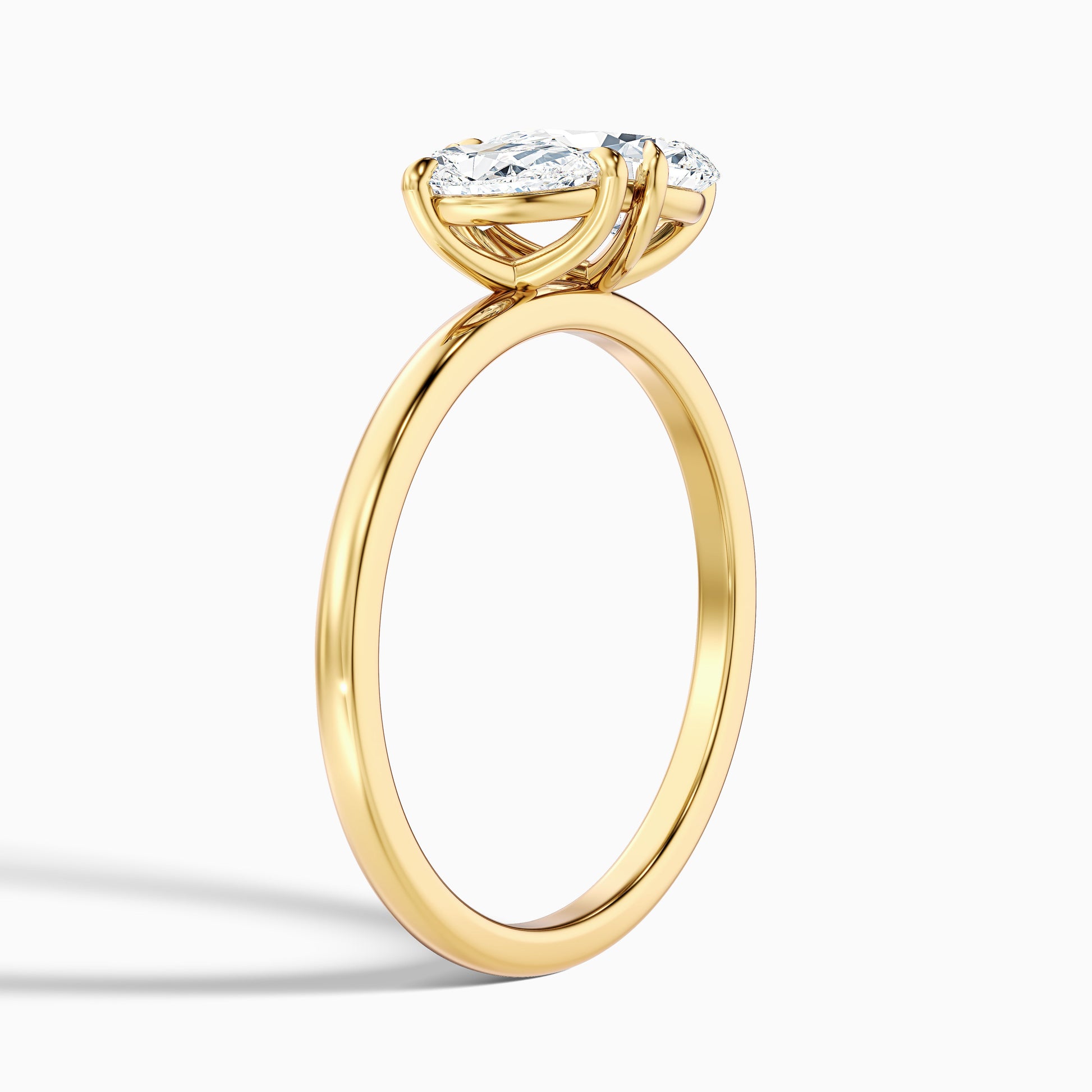 Side view of Rosalyn Toi Et Moi Engagement Ring featuring pear diamonds in yellow gold, available in both moissanite and lab-grown diamond