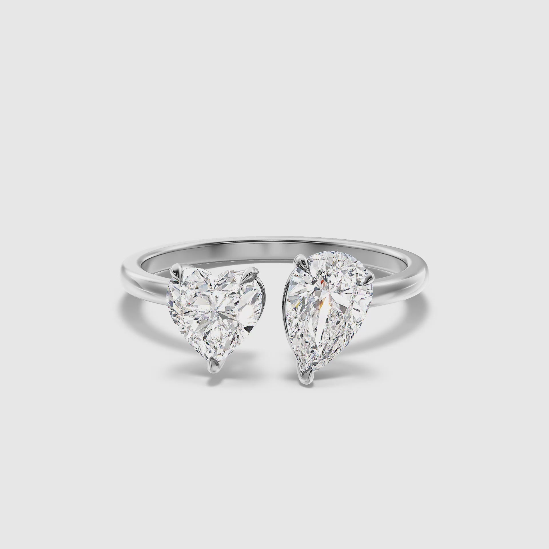 Load video: Crystal Toi Et Moi Engagement Ring With Heart and Pear Cut Diamonds